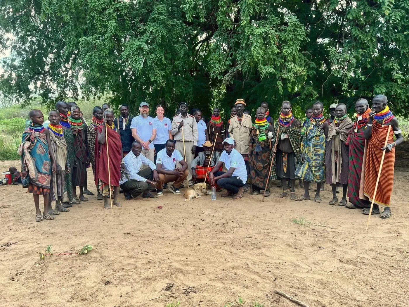 Elder Lokir with members of the Arumrum under a large tree in Komio.