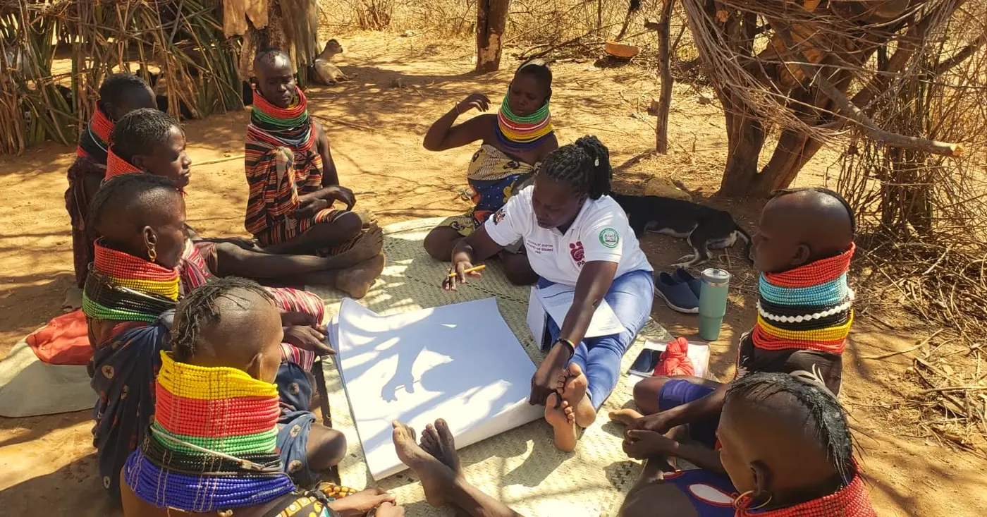 A PAIR researcher leading a participatory session with Turkana women.